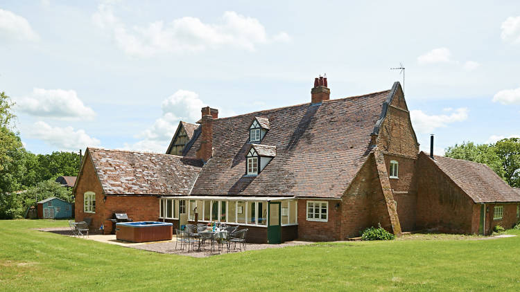 A rural farmhouse with an alfresco hot tub