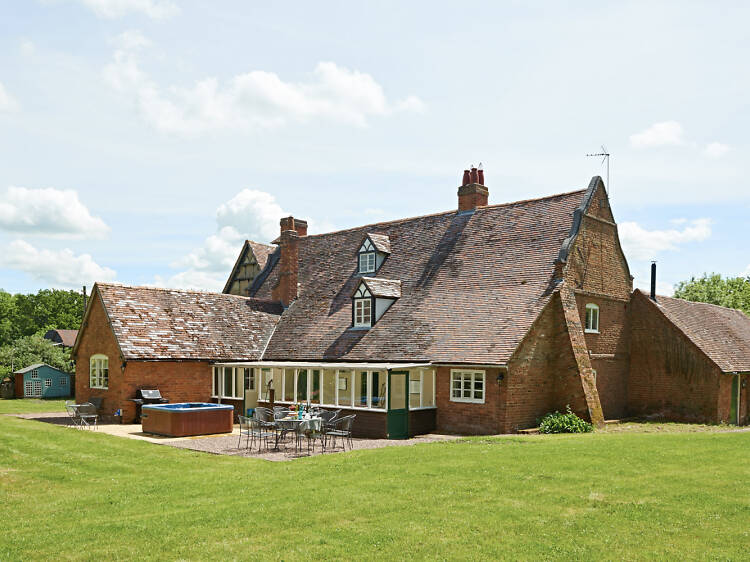 A rural farmhouse with an alfresco hot tub