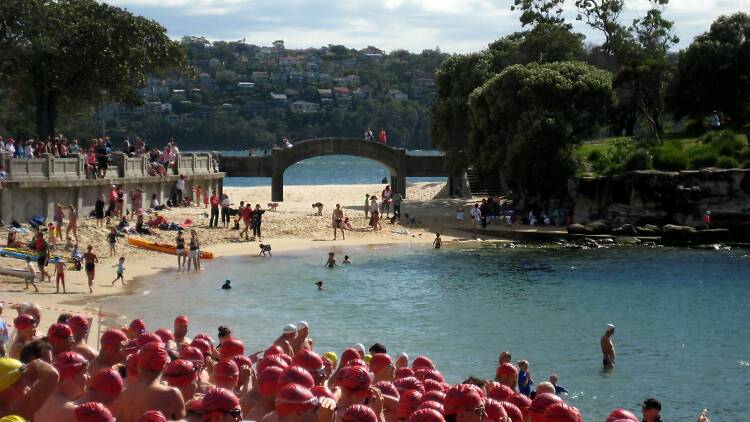 People ready for a swimming race.