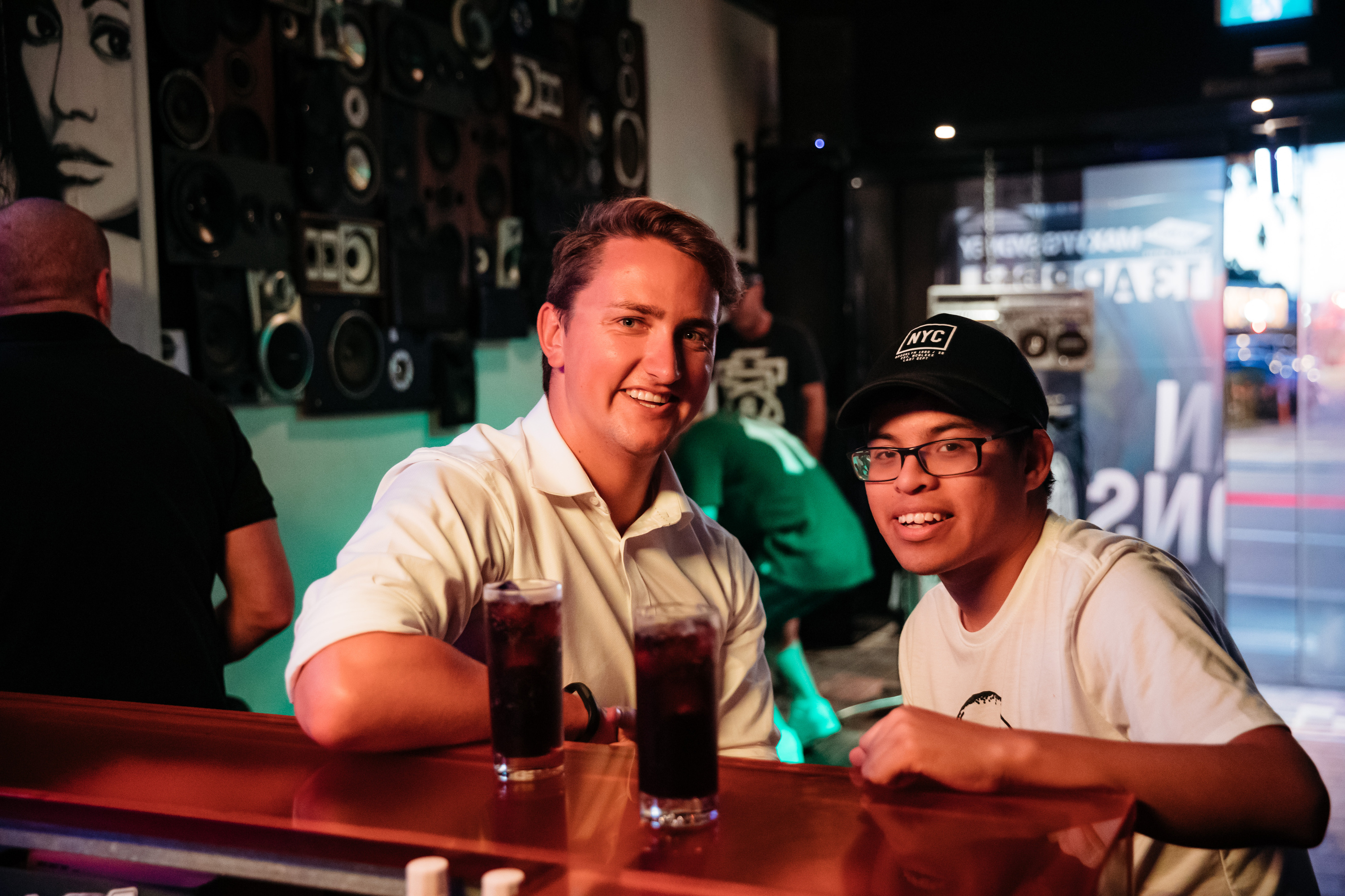 Volunteer David and Gig Buddy Will sat at the bar at Hustle and Flow, Redfern