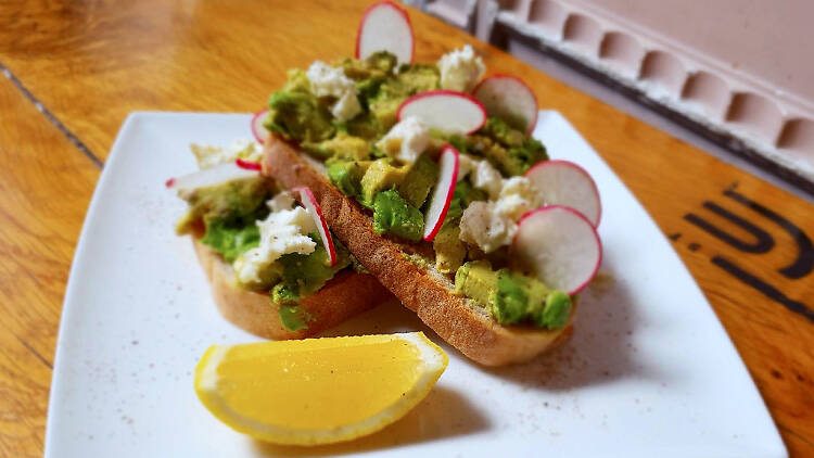 Avocado on toast with radish and lemon