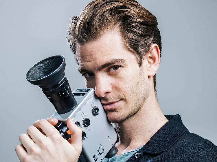 Andrew Garfield holding an old camera