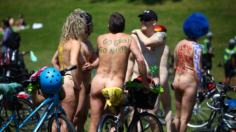Naked people with body paint and bikes at World Naked Bike Ride.