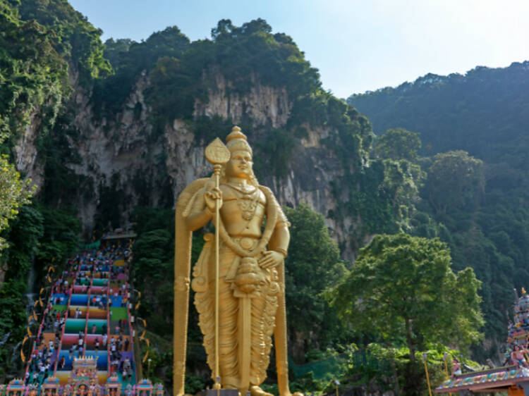 Climb the rainbow staircase at Batu Caves