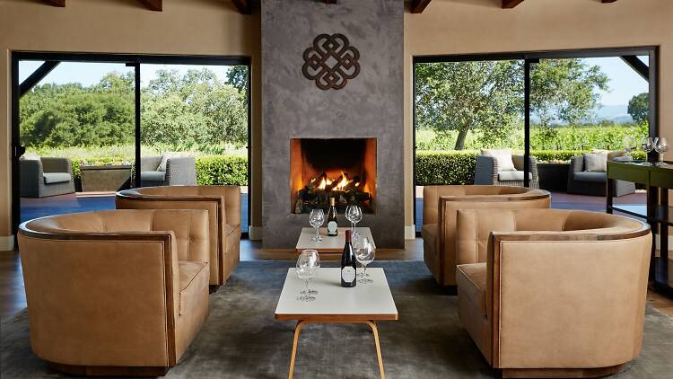 The cozy, fireplace-lit interior of Benovia Winery's tasting room