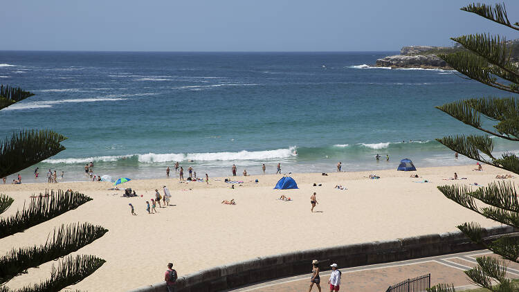 People on the sand at Coogee Beach.