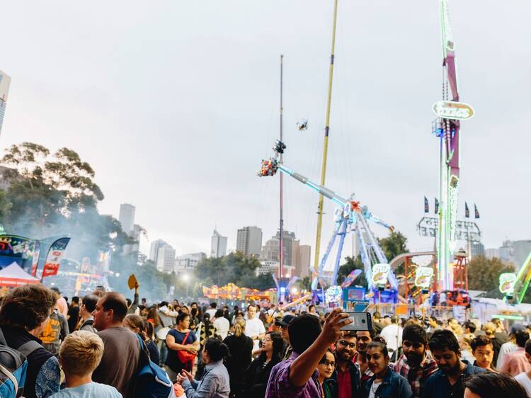 People walking around carnival at Moomba Festival