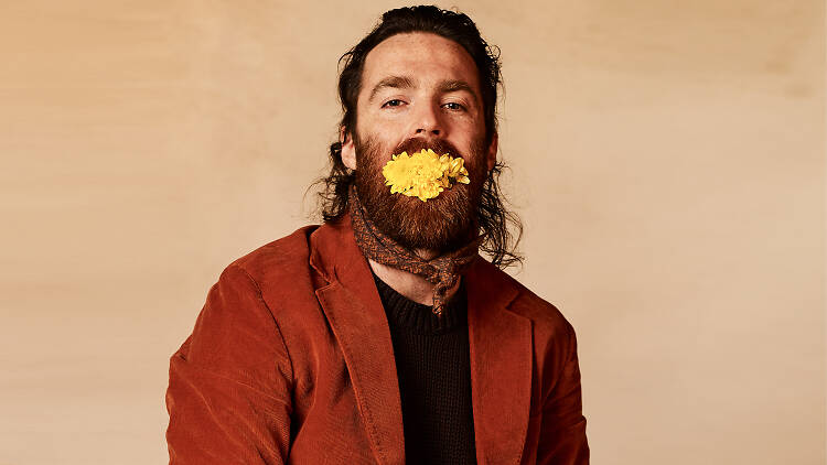 Nick Murphy with yellow flowers in his mouth (weird).