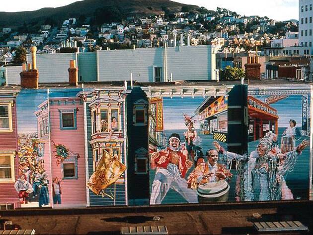 Carnaval Mural A colorful mural of Carnaval with a hill in the background