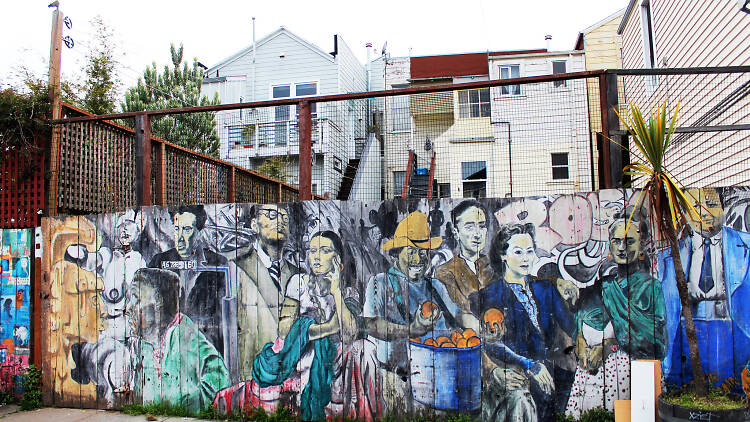 A mural of people in front of houses