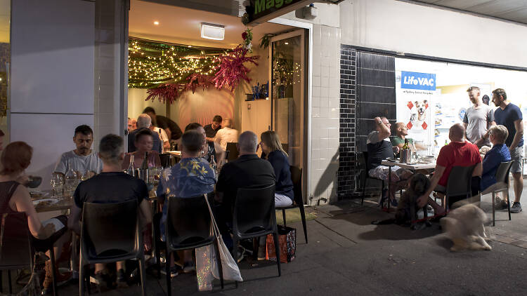 People sitting outside a restaurant in Erskineville