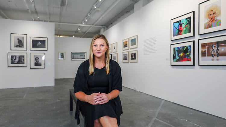 Woman sitting in an art gallery.