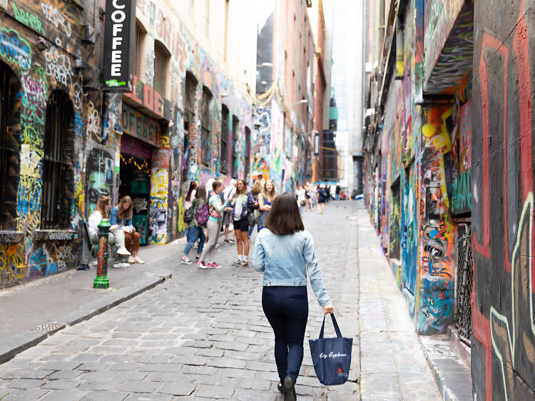 People walking down a Melbourne laneway.