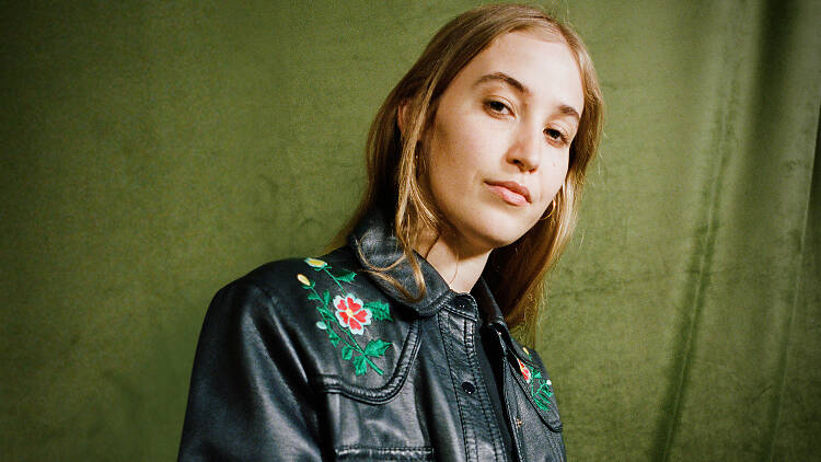 The singer Hatchie in a great jacket with embroidery.