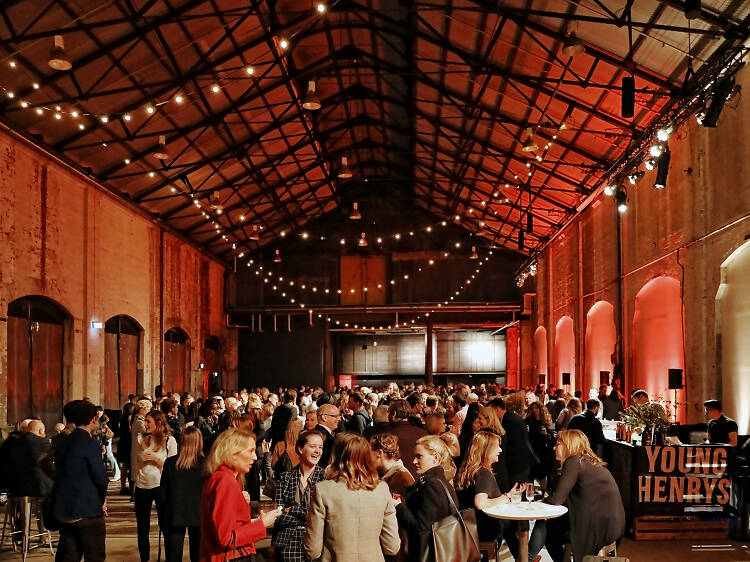 People at an evening talk inside Carriageworks at the Sydney Writers' Festival