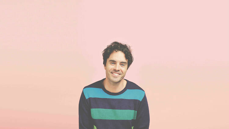 Damon Gameau on a pink background.