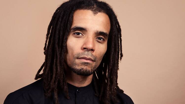 Hip hop artist and writer Akala looking at the camera