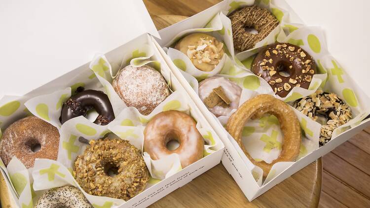 Boxes of iced doughnuts.