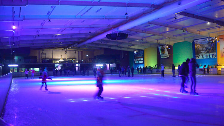 People ice skating at a disco night at Penrith Ice Palace.