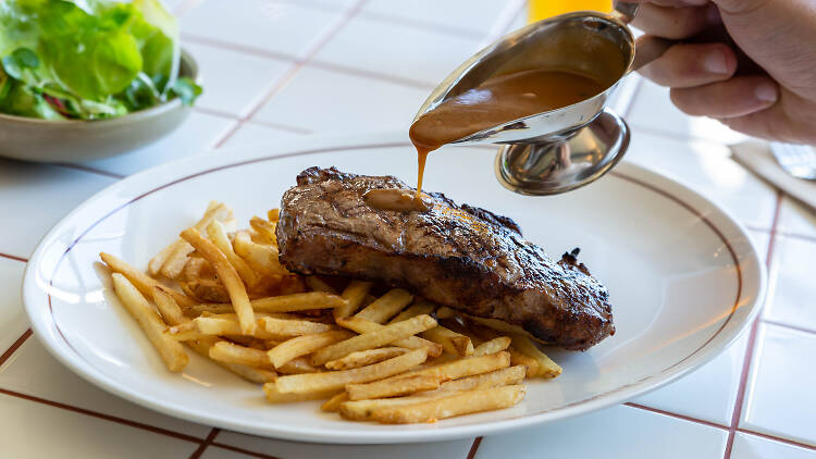 Ambervale Hotel's steak and chips with gravy being poured