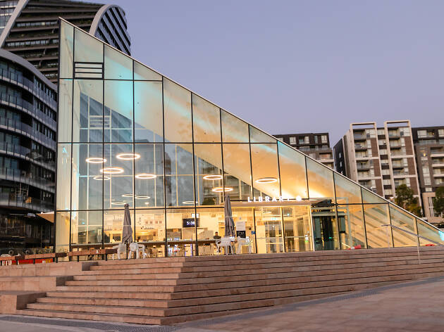 Cafe Noun exterior The glass pyramid at the Green Square Library at sunset
