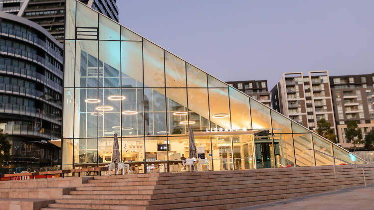 The glass pyramid at the Green Square Library at sunset