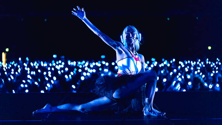 Woman doing yoga in the dark.