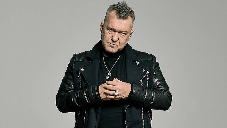 Jimmy Barnes looking angry in a sassy black outfit.