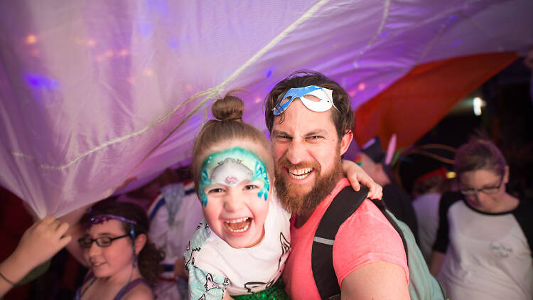 Father and child having fun at a family rave