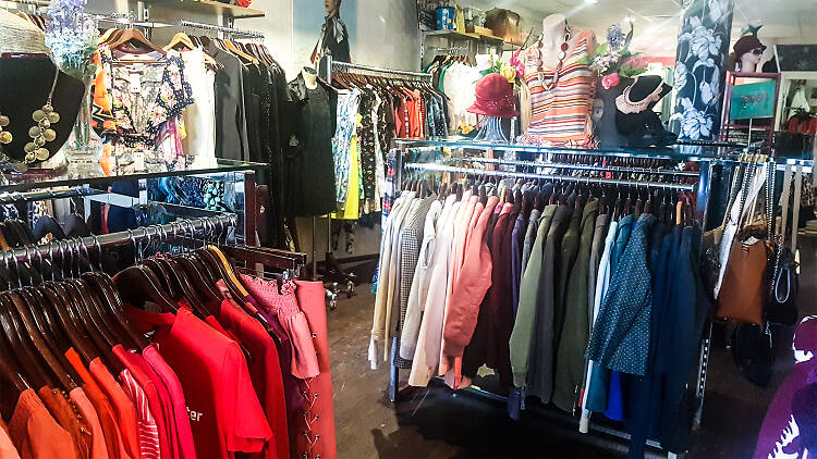 Colourful racks of clothes at the Red Cross Op Shop in Newtown.