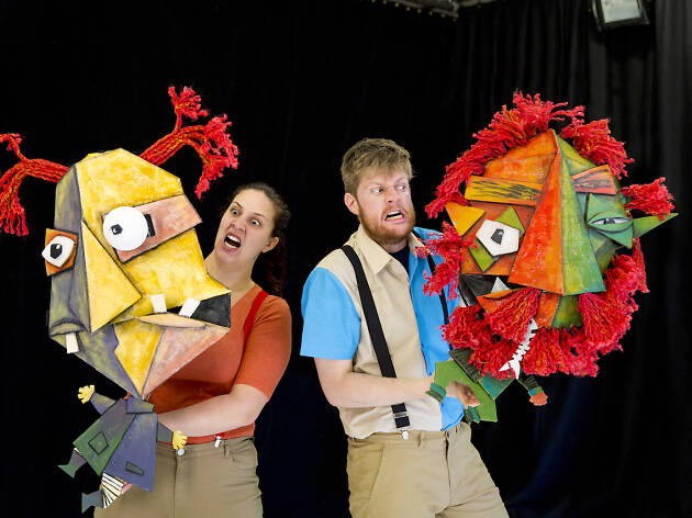 Roald Dahl’s the Twits Two actors holding colourful puppets in front of a black wall