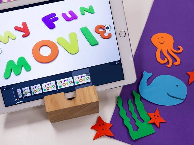 Mini Stop Motion A child's sleeve with animated animals on it in front of a white piece of paper that spells out "My fun movie".