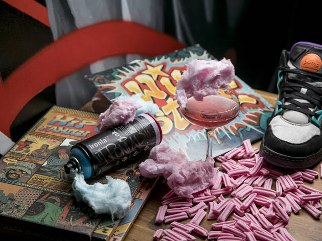 Hustle & Flow 2019 venue image Hip hop records, fairy floss, cocktail and a sneaker on a table at Redfern bar Hustle and Flow