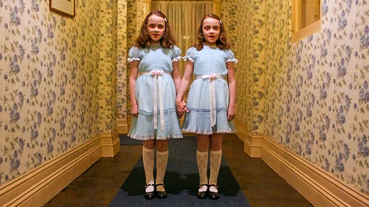 Two children holding hands in blue dress, Still from The Shining (1980)