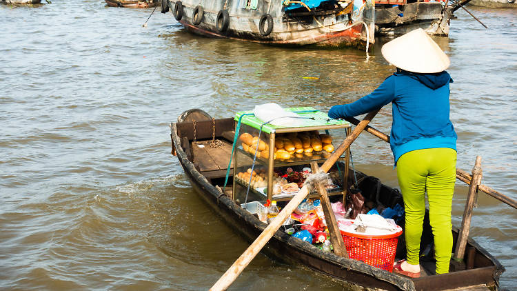 Shop by boat at Cai Rang Floating Market