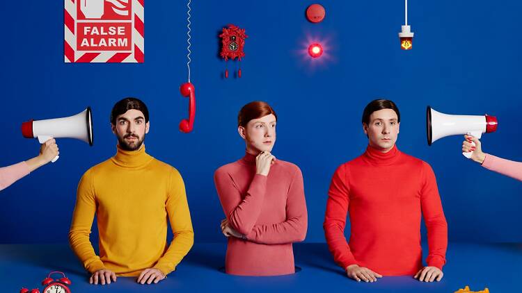 Press image for Two Door Cinema Club with blue backdrop