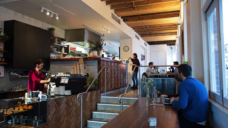 people sitting inside cafe at One Another Cafe Newtown