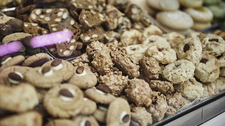 Piles of biscuits behind a glass counter