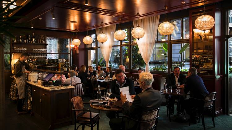 People sitting inside restaurant eating at Bopp & Tone Restauran