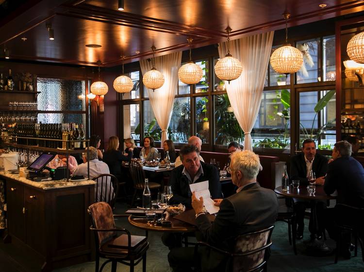 People sitting inside restaurant eating at Bopp & Tone Restauran