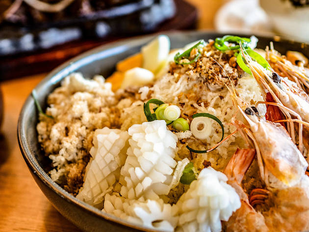 Bowl of seafood fried rice and other dishes at Kasalo