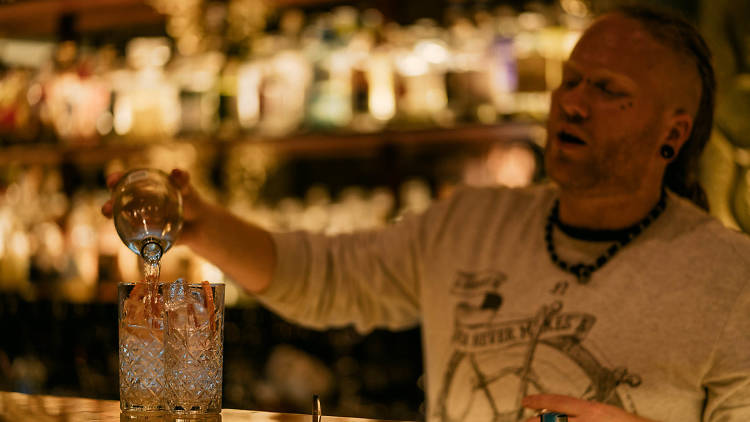 Man making cocktails at a bar