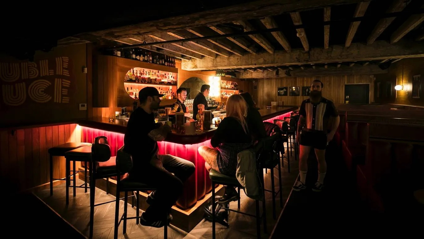 Interior of low-lit bar.