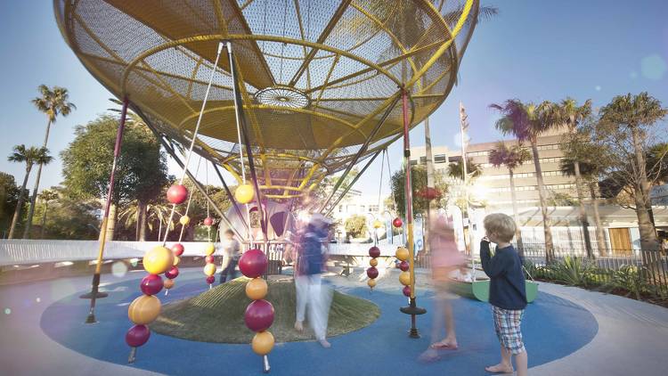 Children playing on the equipment at Prince Alfred Park Playground, Sydney