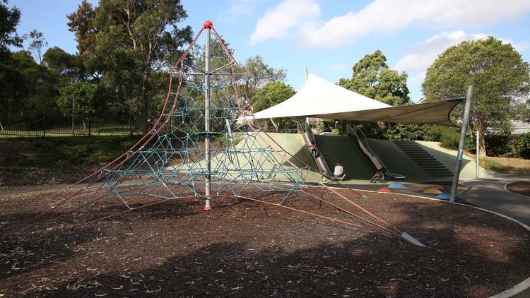 Climbing net and slides at playground on the Bay Run