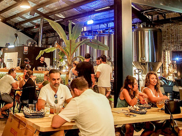 One Drop Brewing Co People drinking beer inside One Drop Brewing Co