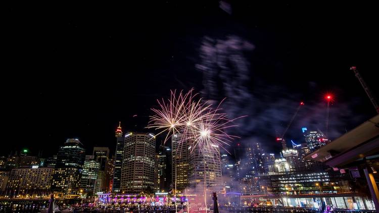 The city skyline view from Darling Harbour with fireworks.