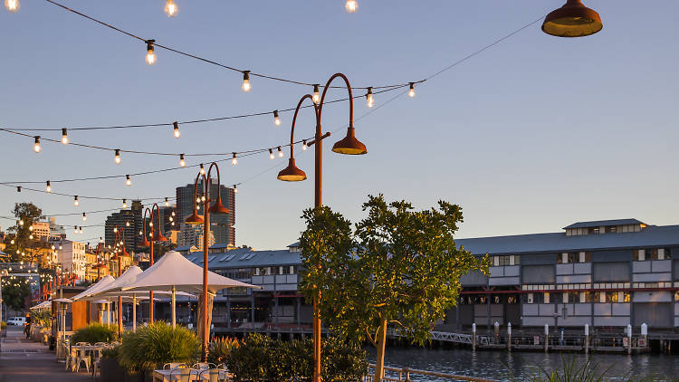 Tables by the water at Pier One Sydney Harbour.