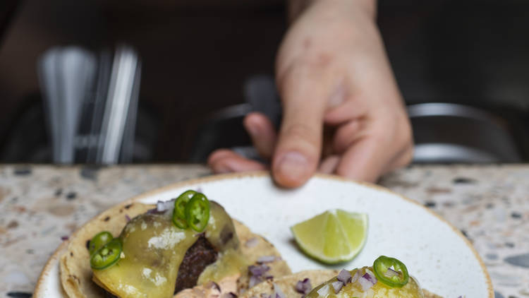 Aged cheeseburger tacos at Temper Soho