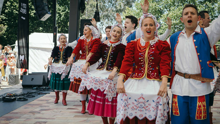 Dancers dressed in traditional Polish costume